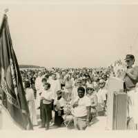 A group of people standing at a ceremony