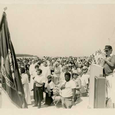 A group of people standing at a ceremony