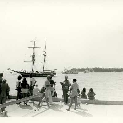A boat in the ocean with on lookers