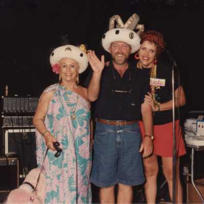 Unknown people with a pink poodle.