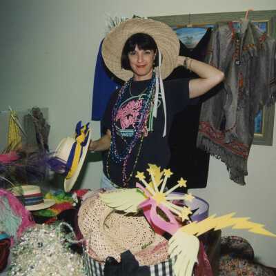 Unknown lady trying on hats.