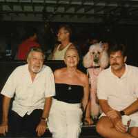 Capt. Tony sitting with a few unknown people.
