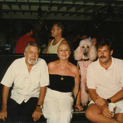 Capt. Tony sitting with a few unknown people.