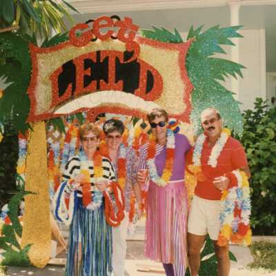 Four unknown people dressed up.