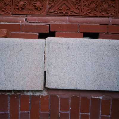 Terra cotta, brick, and stone detail work on the exterior.