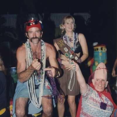 Unknown people dressed up on a float in the parade.
