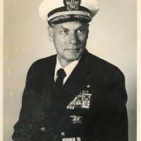 A photograph of a man in the U.S. Navy