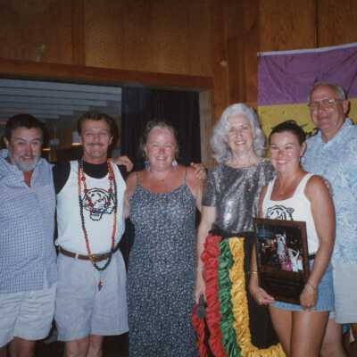 A group of unknown people at an awards ceremony.
