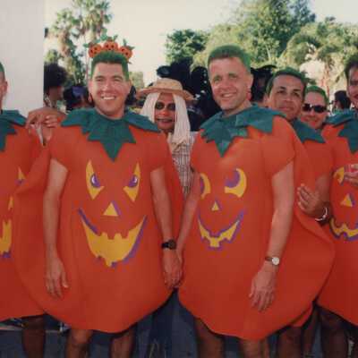 Unknown people dressed up as pumpkins.