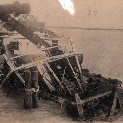 Steamer sinking at pier