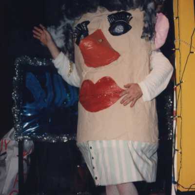 Unknown person dressed up on a float.