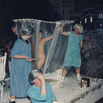 Unknown people dressed up on a float.