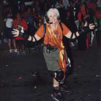 An unknown woman on skates, skating on the street during the parade.