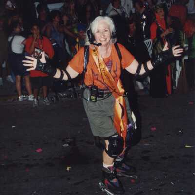 An unknown woman on skates, skating on the street during the parade.
