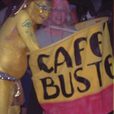 Two unknown people dressed up, one as café bustelo.