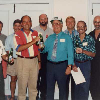 Unknown group of men, a few holding beer.