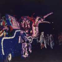 A float in the parade that reads Fast Buck Freddie