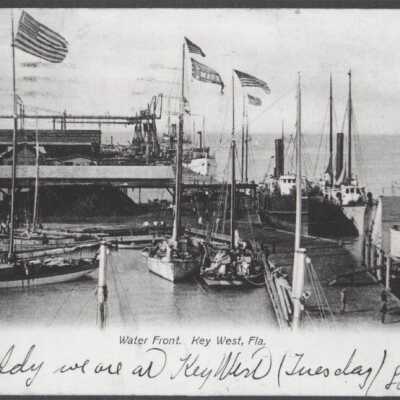 Sailboats and steamers at dock