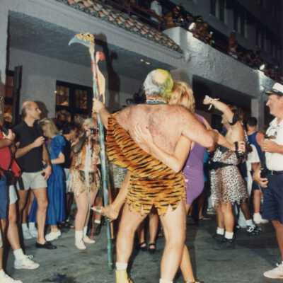 Unknown people dressed up in front of La Concha hotel.