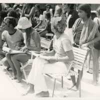 A group of unknown people at the pool