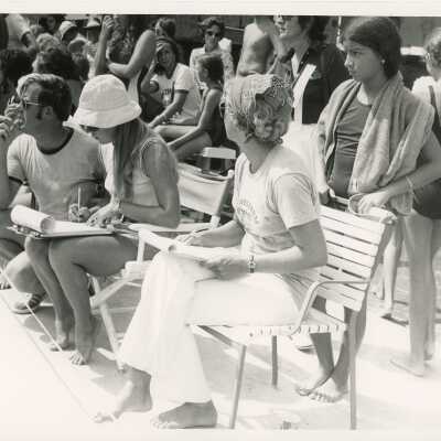 A group of unknown people at the pool
