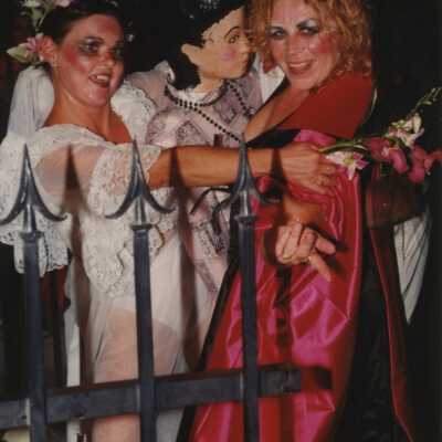 Unknown people dressed up on a float.