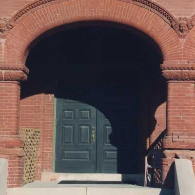 The front door and brick archway.