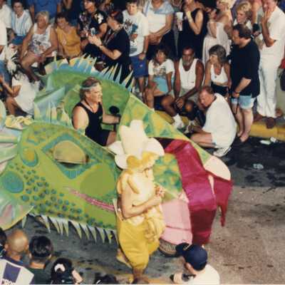 A small float in the parade being driven by a scooter.