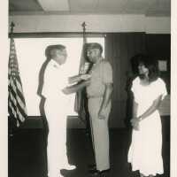 3 Unknown people at a ceremony