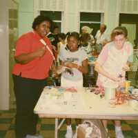 A group of unknown people making face masks.