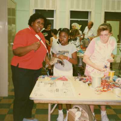 A group of unknown people making face masks.