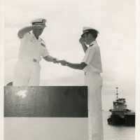 2 Men in uniform shaking hands