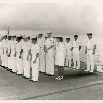 Men and woman in uniform standing