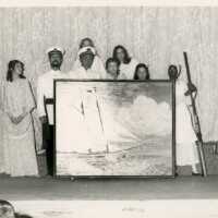 A group of unknown people with artwork