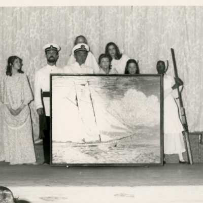 A group of unknown people with artwork