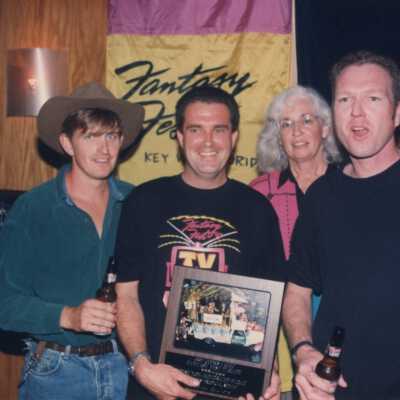 Unknown people accepting an award at the award ceremony.