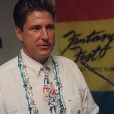 Unknown man speaking at the award ceremony.