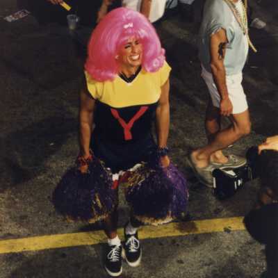 An unknown man dressed up as a cheerleader.