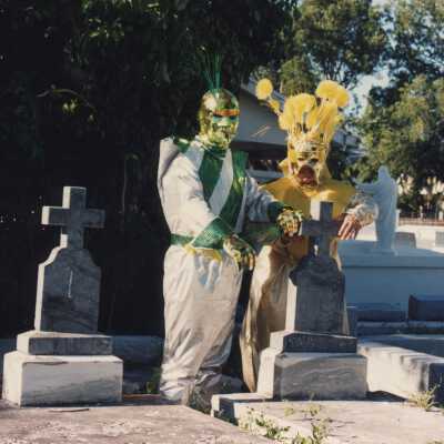 Unknown people dressed up at the cemetery.