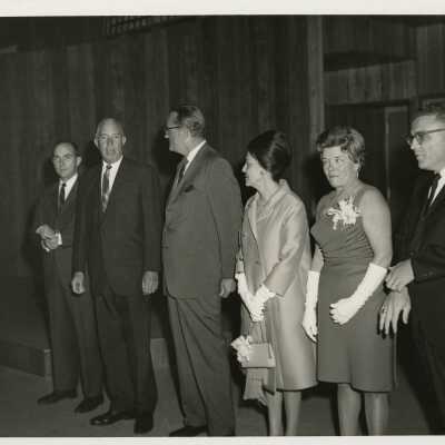 Unknown men and woman standing at a reception