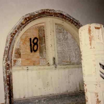 A window near the stairway labeled number 18.