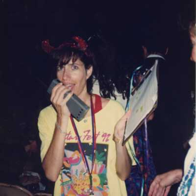 Rita Troxel talking into a walkie-talkie.