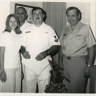 Unknown group, 3 in uniform standing in an office
