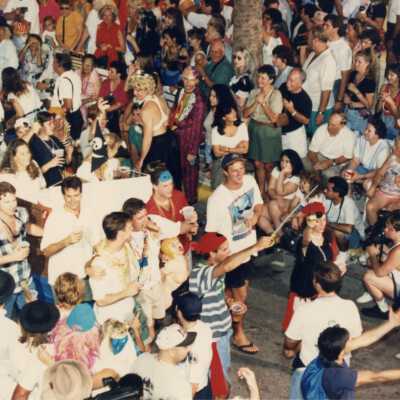 People in the parade walking down Duval Street.