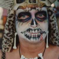 An unknown person with their face painted.
