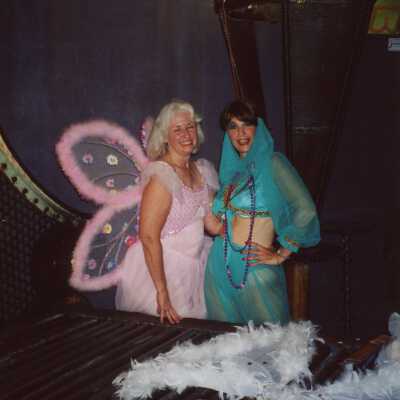 Two unknown woman dressed up.