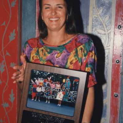 Unknown woman with a plaque.