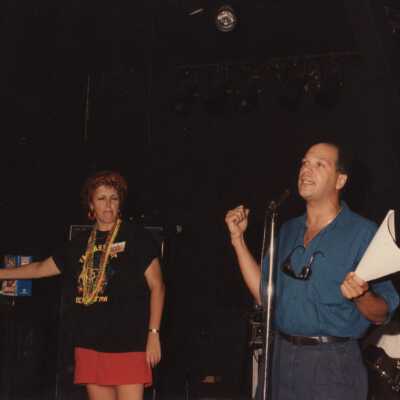 Two unknown people on a stage.