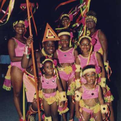 Unknown woman and children dressed up.