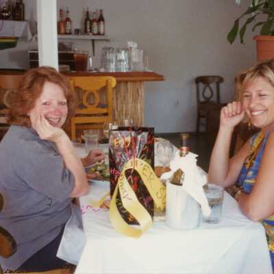 Two unknown woman at an award ceremony.